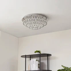 Lindby Deckenleuchte Antonino, Ø 55 cm, 8-flg., Kristall, G9