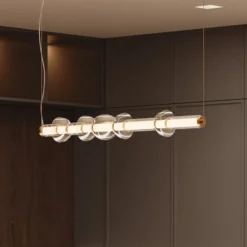 Maytoni LED-Hängeleuchte Cosmo, messing, Länge 98 cm, Glas
