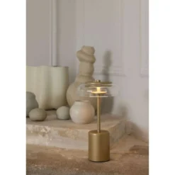 Nuura LED-Akku-Tischlampe Blossi, Höhe 26 cm goldfarben/klar
