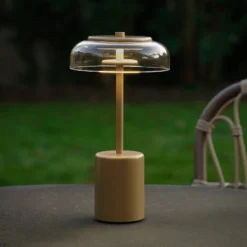 Nuura LED-Akku-Tischlampe Blossi, Höhe 26 cm goldfarben/klar