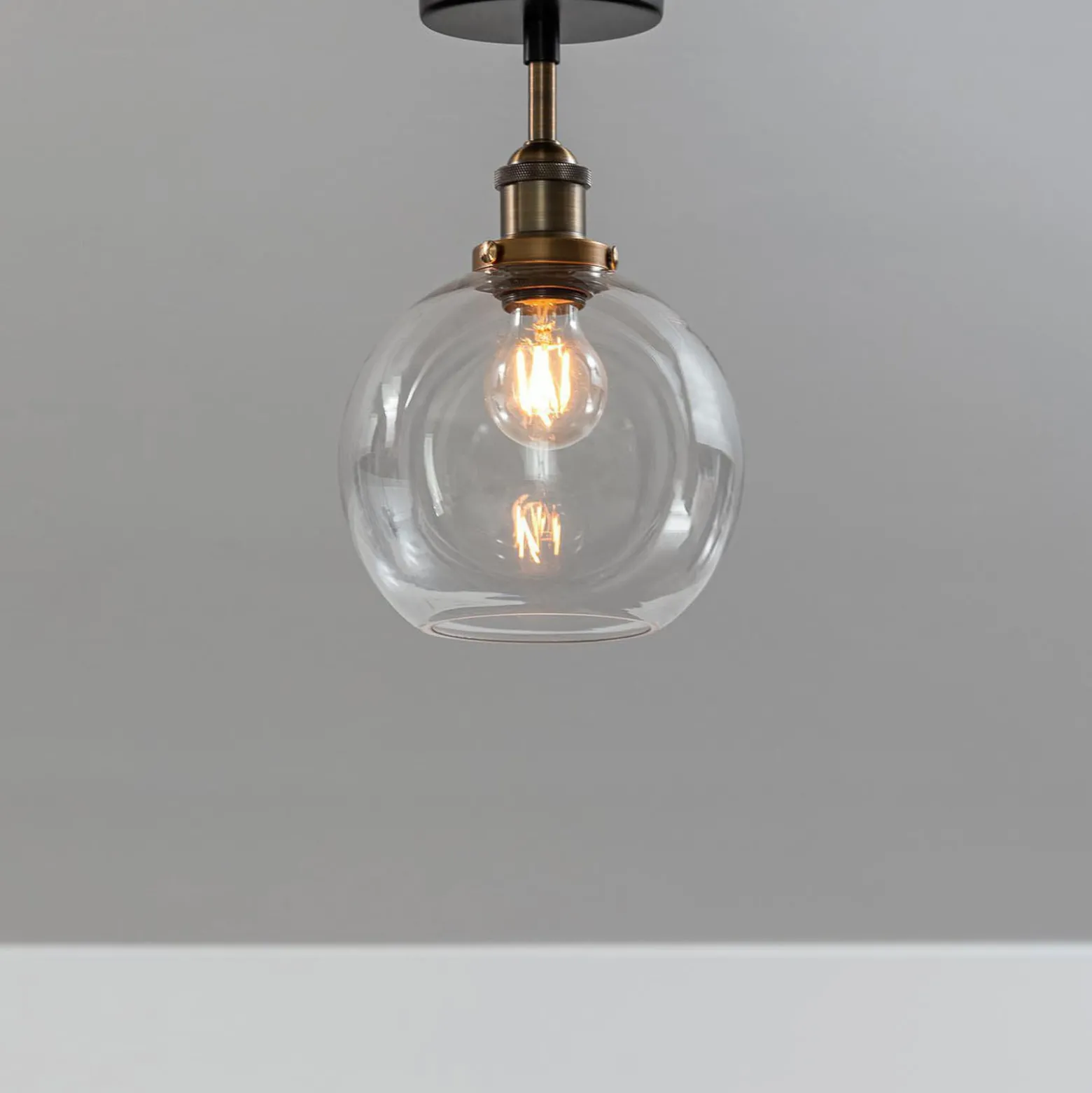 PR Home Deckenleuchte Omega, klar/messing/schwarz, Ø 20 cm