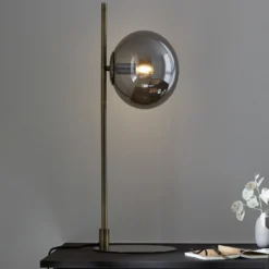 Tischleuchte Dione, messing/rauchgrau, Glas, Eisen
